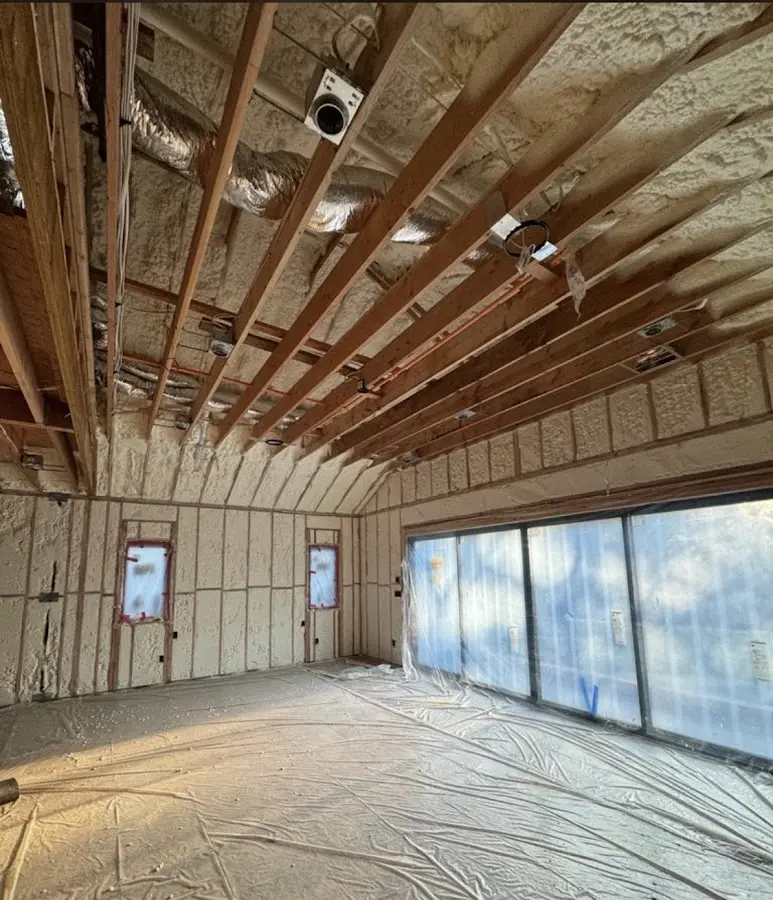 Interior walls and ceiling insulated with spray foam during new construction in Forestville